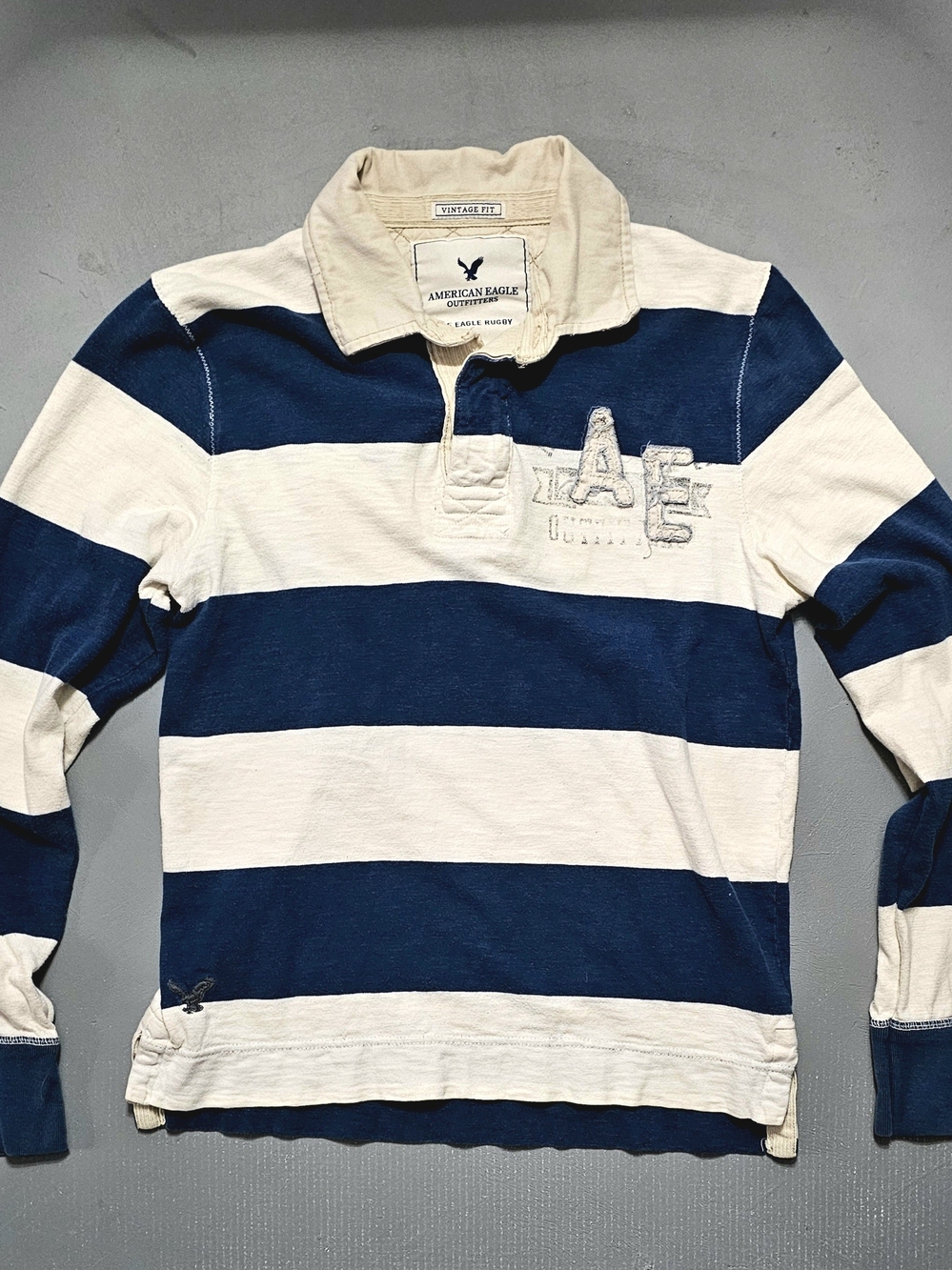 American Eagle Outfitters Men’s Navy and Cream Striped Rugby Sweater